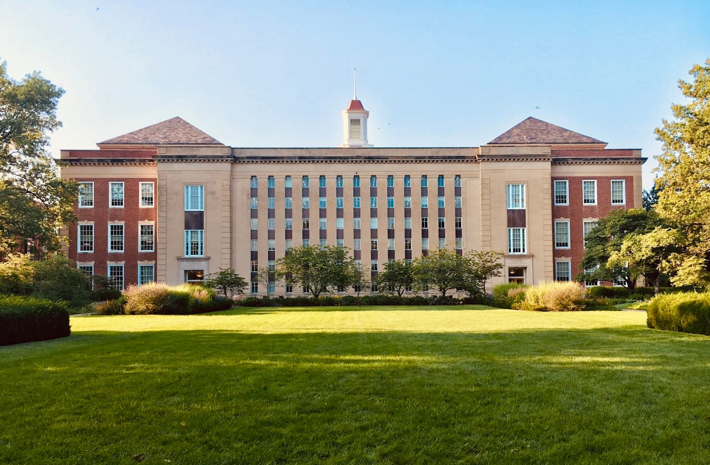 A university campus building on a clear morning